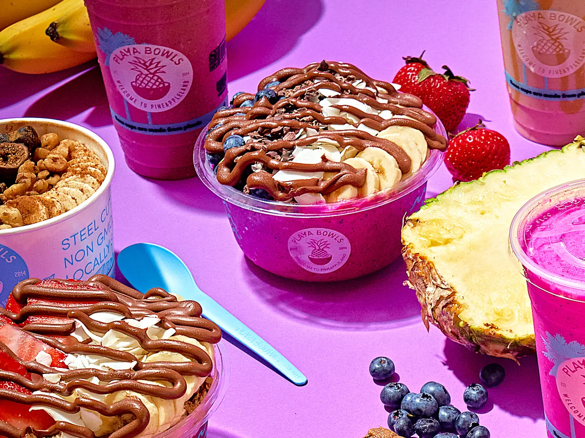 Playa Bowls açaí and pitaya bowls topped with Nutella, banana and coconut, with smoothies and fresh fruit